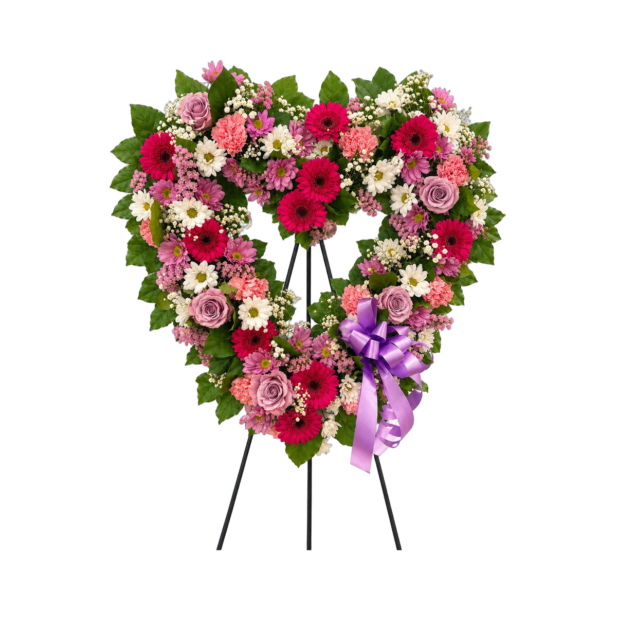 Cœur funéraire sur trépied, en roses lavande, gerberas fuchsia et marguerites, avec un ruban mauve