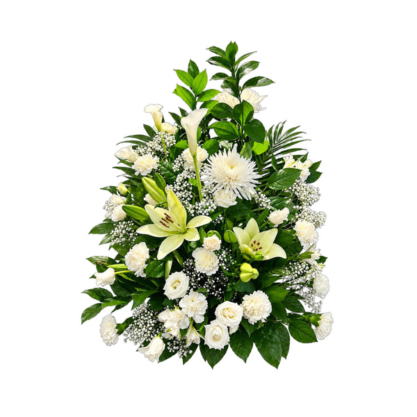 Corbeille funéraire tout en blanc : lys, roses, œillets et chrysanthèmes